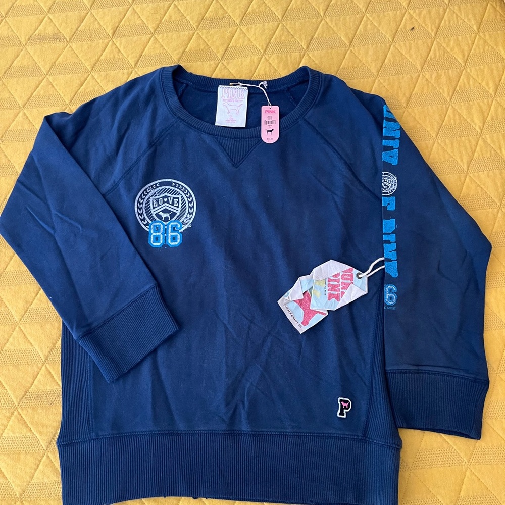 NWT. SLIGHTLY FADED. NAVY SWEATSHIRT. LADIES SIZE L